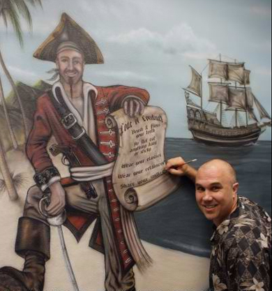 airbrushing pirate mural